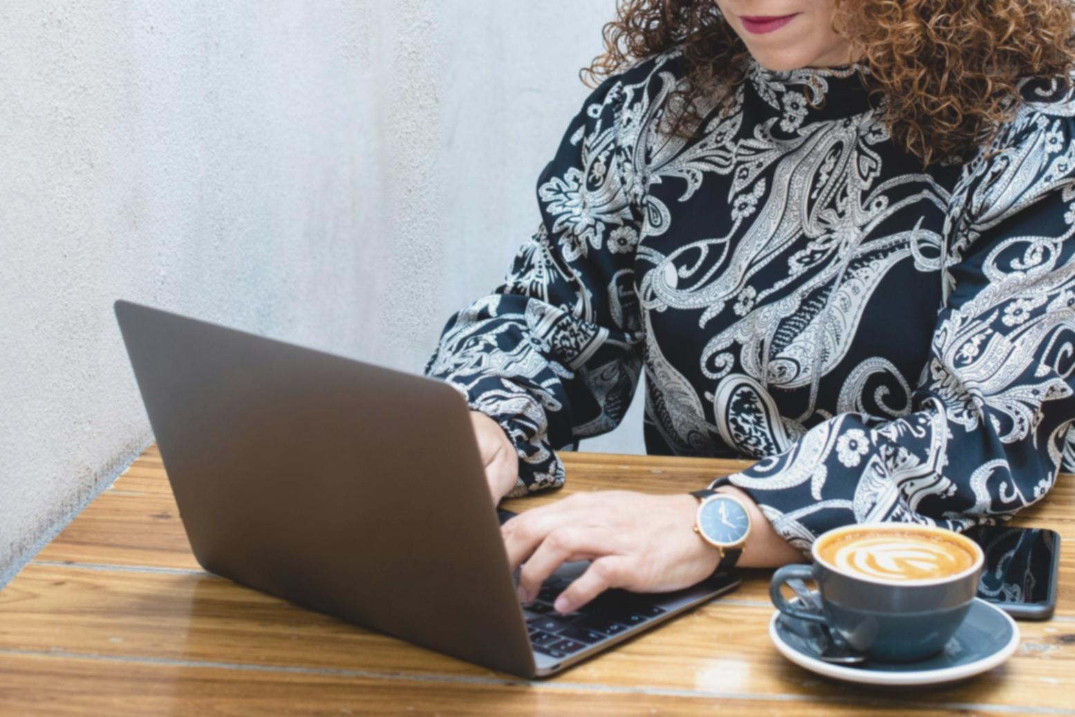 Business team reviewing automated financial reports and analytics on computer screens